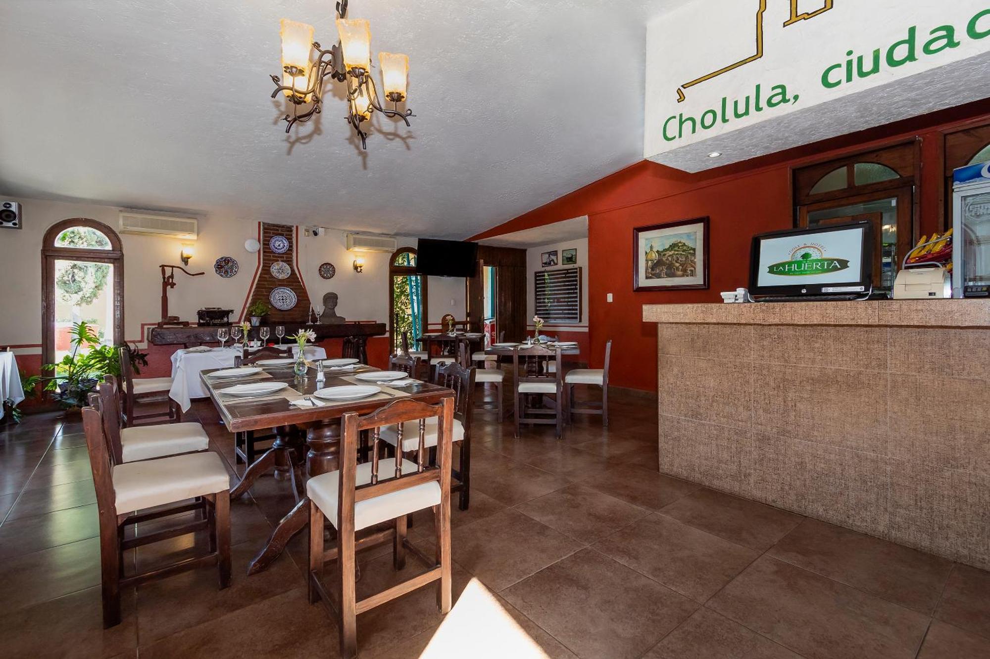 Capital O La Huerta Golf & Hotel Чолула Экстерьер фото