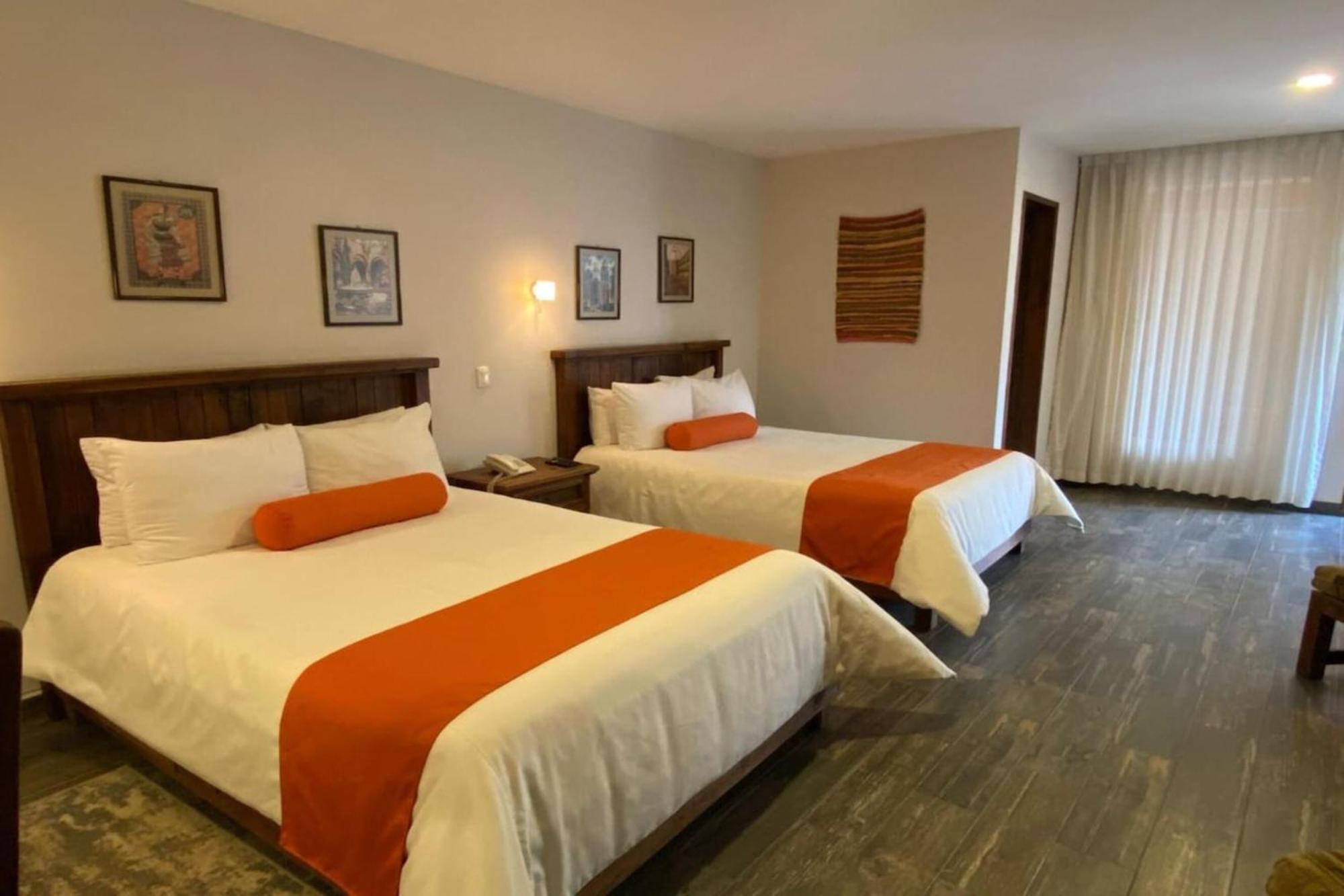 Capital O La Huerta Golf & Hotel Чолула Экстерьер фото