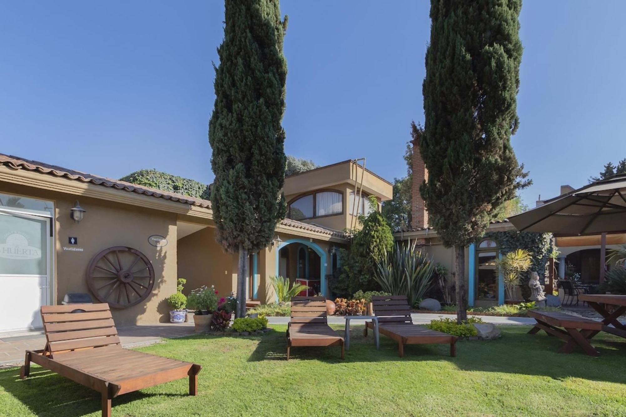 Capital O La Huerta Golf & Hotel Чолула Экстерьер фото
